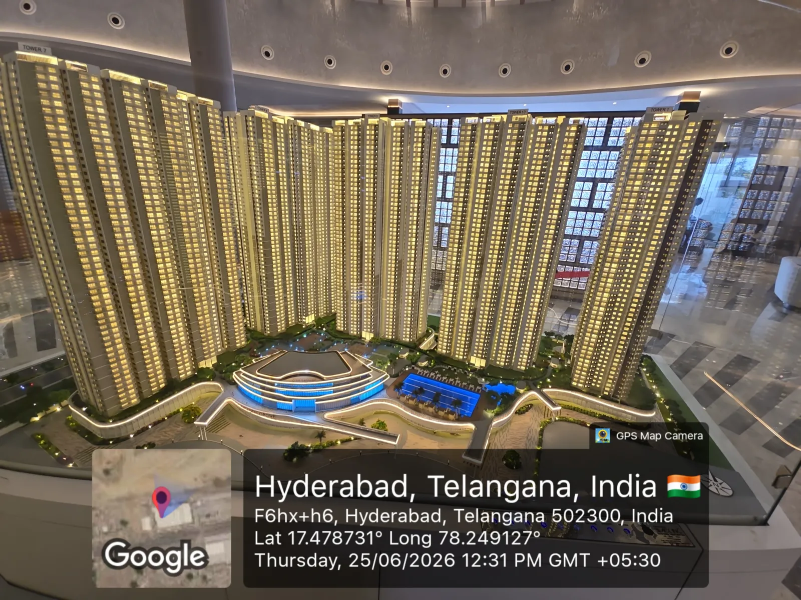 Prestige Golden Grove Scale Model — High-Rise Tower Cluster (June 2026) Architectural scale model of the curved high-rise tower cluster at Prestige Golden Grove with landscaped central amenities, shown at the experience centre, Velimela, June 2026.